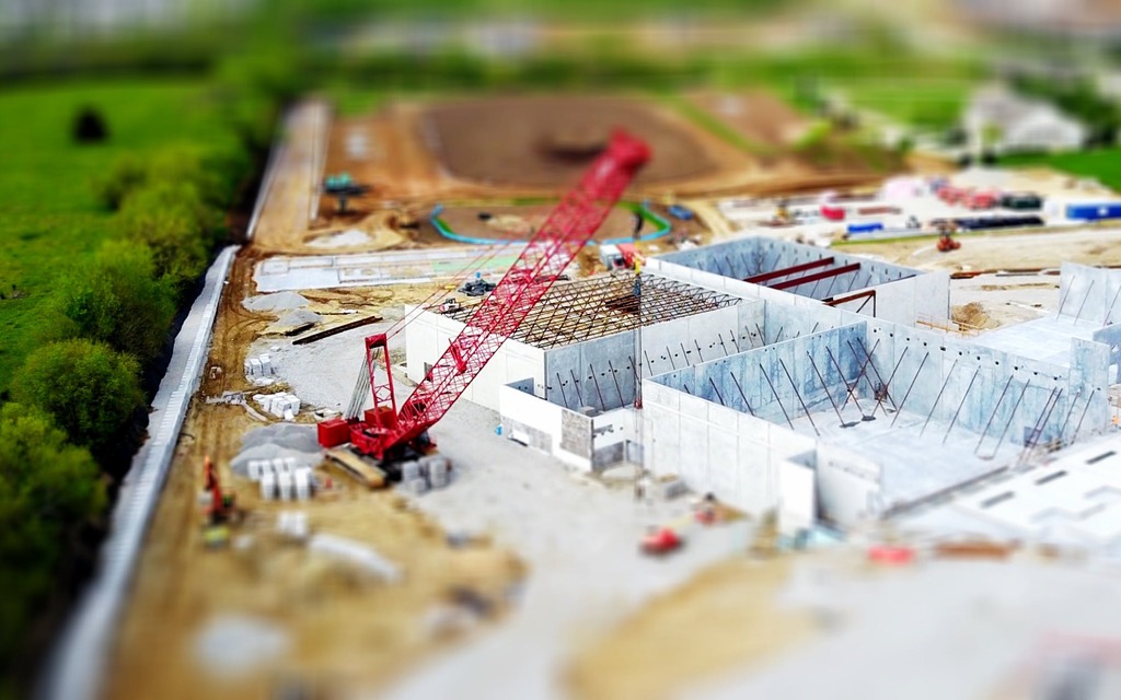 Red crane in a construction zone