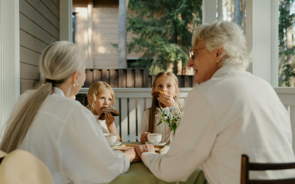 Grandparents eating with their grandkids