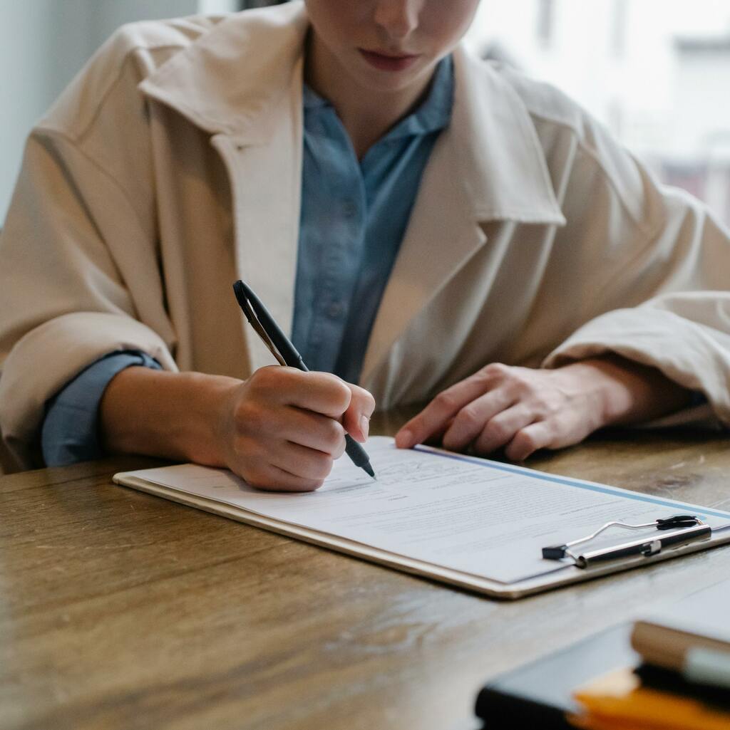Woman filling out a paper