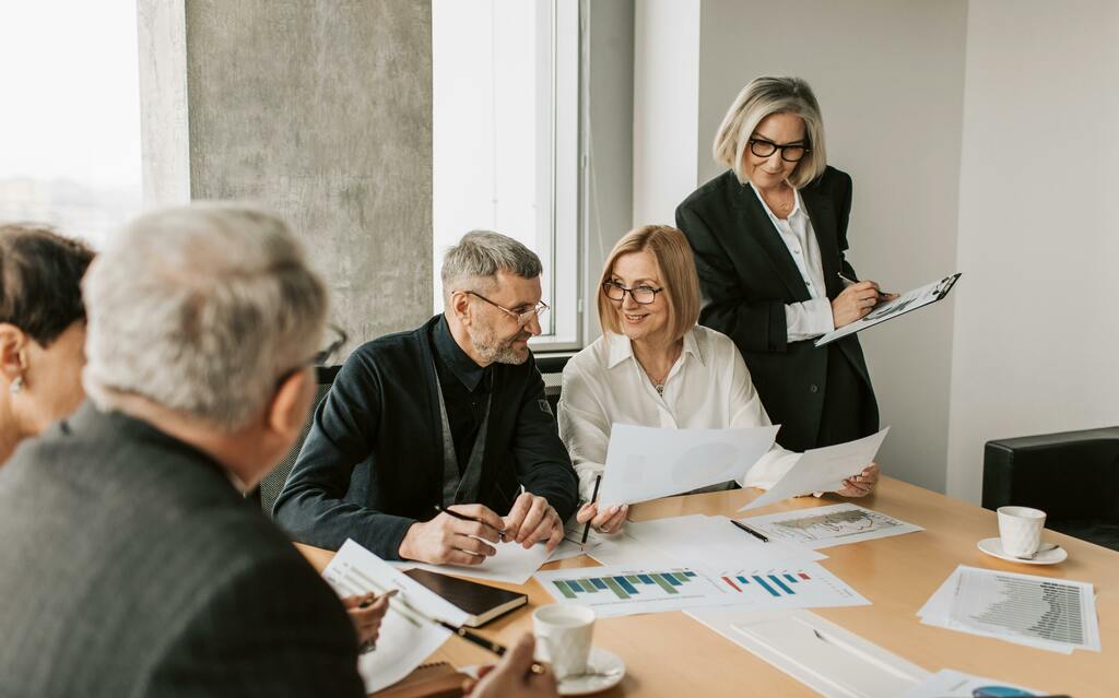 Business meeting with graphs