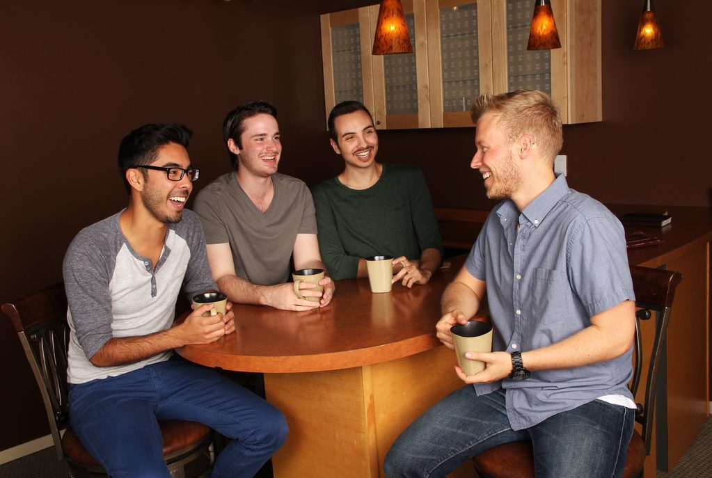 Men relaxing over coffee