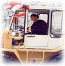 Photo of Ogyen Trinley Dorje in bulldozer