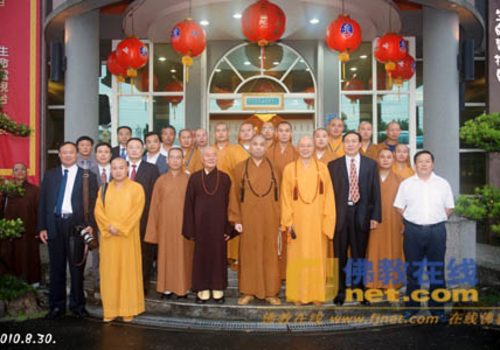 Photograph of Hai Tao with BAC and SARA delegation outside studio, 2010