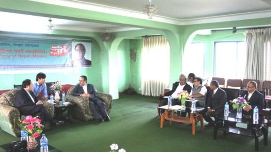 Photograph of Xiao Wunan meeting Prachanda, 2012