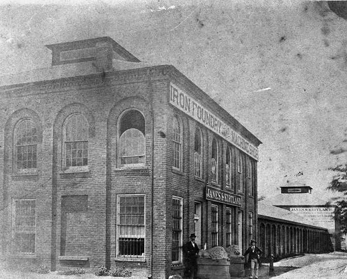 Two story commercial building with sign that says "Iron Foundry"