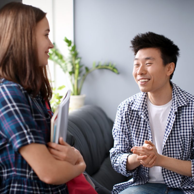 young man talking to therapist