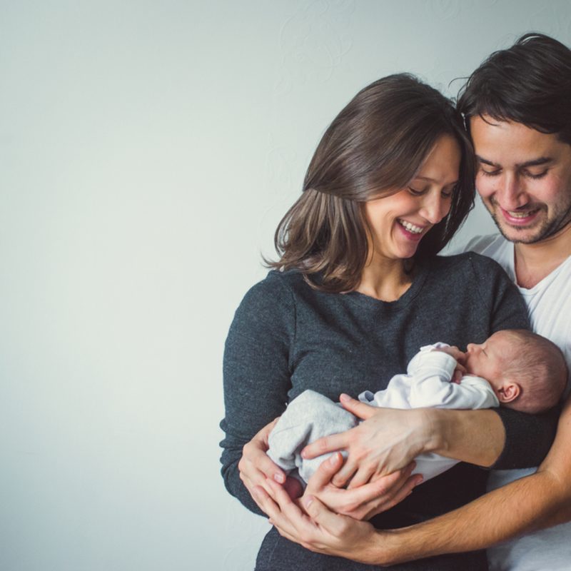 couple holding their newborn baby