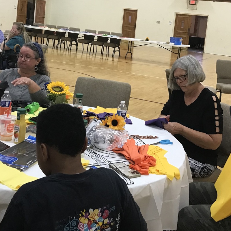 Miss Kay, Angie and Christian making crosses.