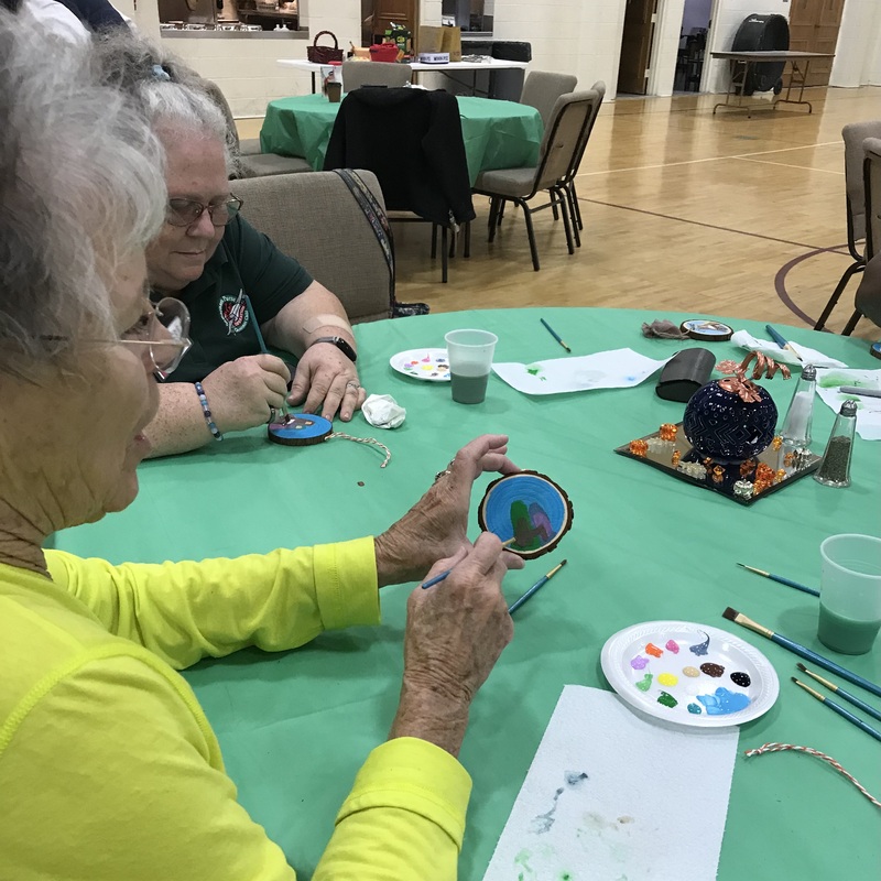 Ms Pat showing her manger ornament